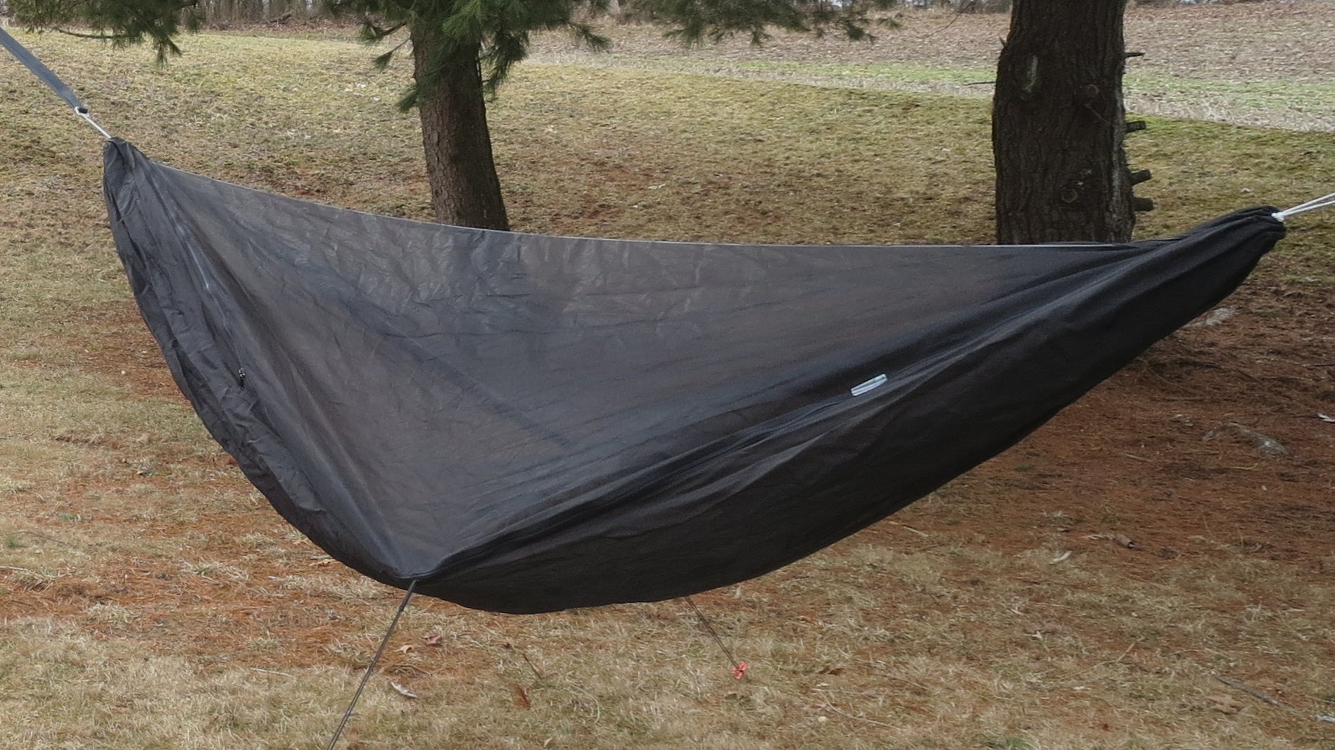 Ultralight gray/black custom hammock for backpacking and camping with bugnet or mosquito net.